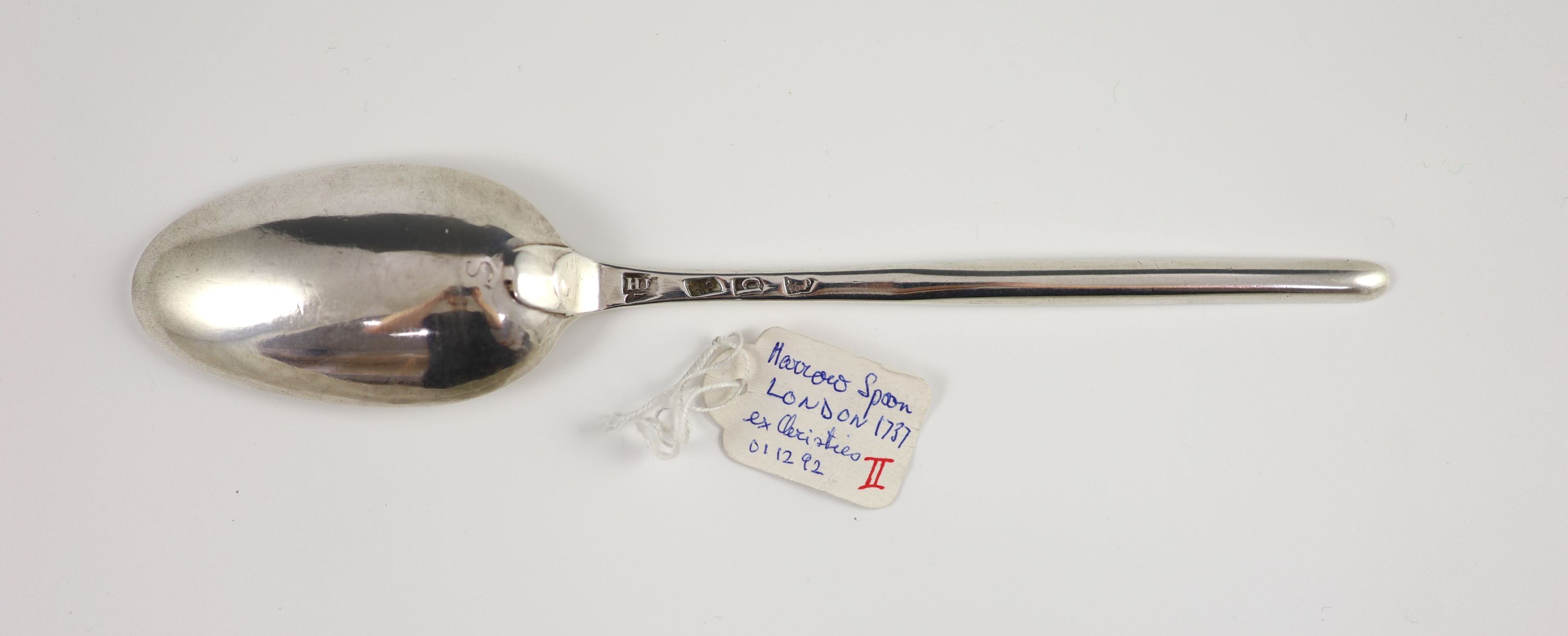A George II silver marrow spoon, London 1737, maker’s initials ‘I.H’, 22cm long, 1.7 oz.